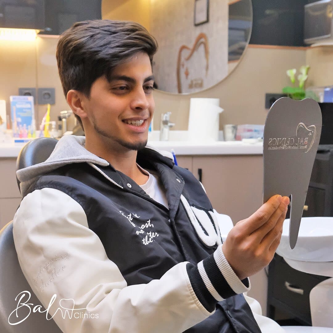 Patient admiring new smile